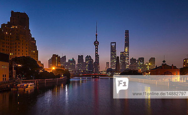 Waibaidu bridge over Huangpu river with Pudong skyline at night  Shanghai  China