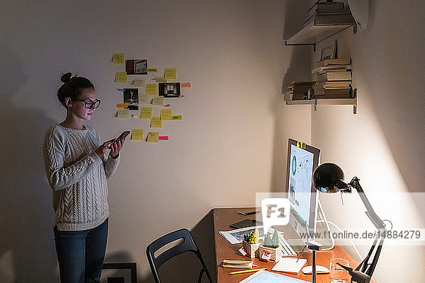 Woman working late at home