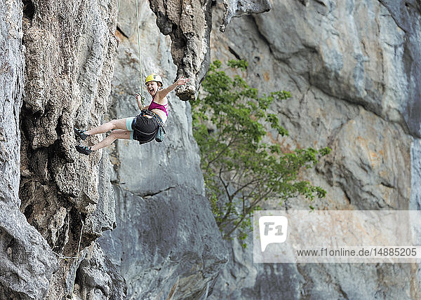 Thailand  Krabi  Lao Liang  happy woman climbing in rock wall