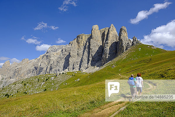 Italy  South Tyrol  Sella group  hikers walking up Passo di Sella