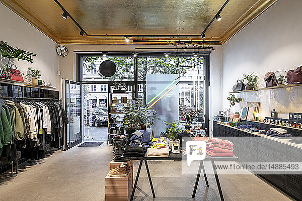 Interior of a modern concept store displaying fashion