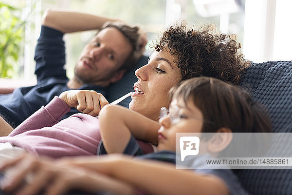 Family sitting on couch
