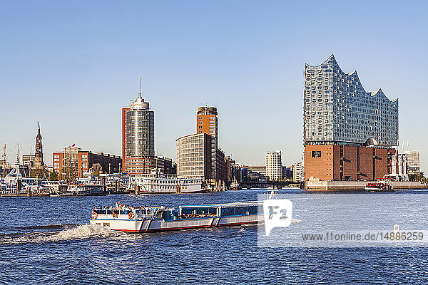 Germany  Hamburg  cityscape with Elbe Philharmonic Hall and tourboat on the Elbe
