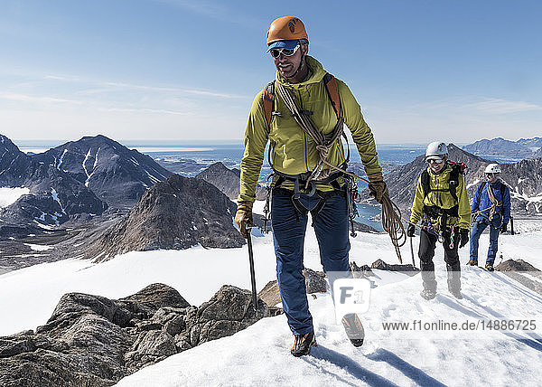 Greenland  Sermersooq  Kulusuk  Schweizerland Alps  mountaineers walking in snowy mountainscape