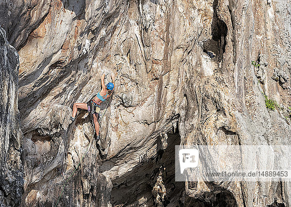 Thailand  Krabi  Lao Liang  woman climbing in rock wall