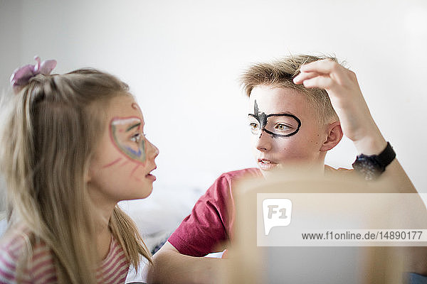 Brother and sister preparing for carneval