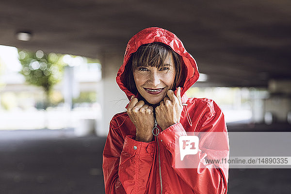 Woman wearing red rain coat  portrait