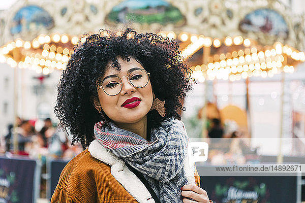 Portrait of young woman wearing glasses and red lipstick