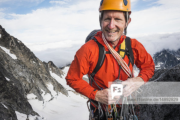 Mature man mountain climbing on Mount Stuart in North Cascade Mountains  Washington  USA