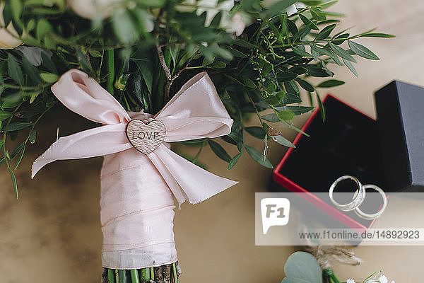 Wedding bouquet tied with pink ribbon