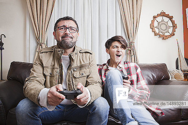 Father and son playing video game
