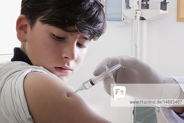 Teenage boy getting vaccination