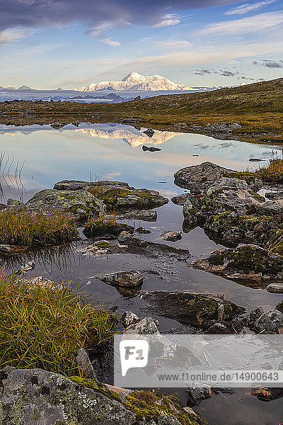 Scenic view of the South side of Denali reflecting in a pond along the Kesugi Ridge Trail Denali State Park South-central Alaska; Alaska United States of America