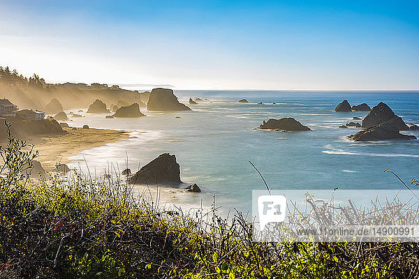 Morning mist rising from Harris Beach  near Brookings  Oregon. The rock formations add to the views looking out at the Pacific Ocean; Oregon  United States of America