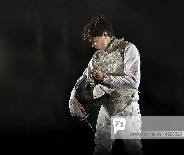 Teenage boy fencing