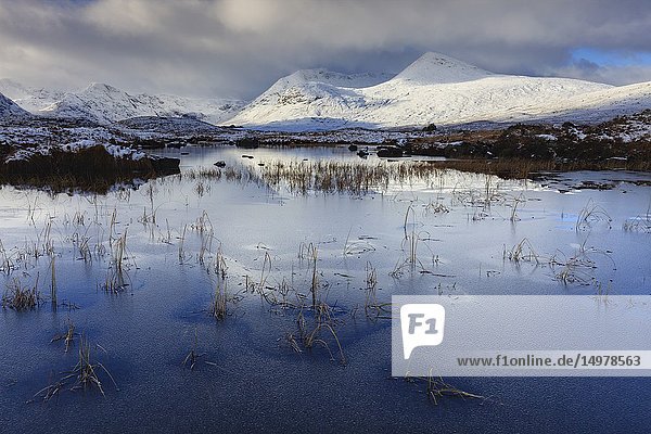 An ice covered River Ba on the southern edge of Rannoch Moor in the Scottish Highlands  captured on a bitterly cold morning in early November following the first snowfall of the year.