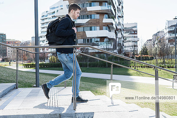 Man running down stairway Milan Lombardia Italy