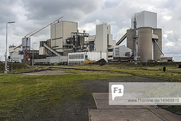 IJmuiden Netherlands. Huge heavy steel production plant and industry terrain producing various kinds of steel inside an CO2 emitting factory. The steel plant is called Hoogovens and is owned by Tata Steel an international corporation who also suffers from decline in revenues and ever increasing demands on corporate responsibility regarding labour and climate.
