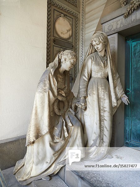 Picture and image of the stone sculpture of 2 mourning sisters at the door of their mothers pyramid shaped tomb  The Rossi Tomb sculpted by G Benetti in 1878. Section D  no 24  The monumental tombs of the Staglieno Monumental Cemetery  Genoa  Italy.