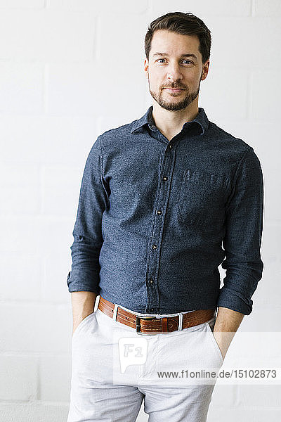 Mid adult man wearing blue button down shirt