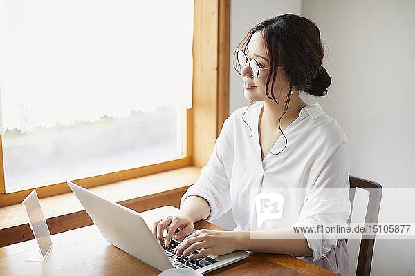 Japanese woman working at a cafe