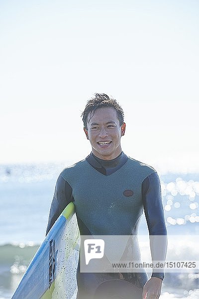 Japanese surfer at the beach