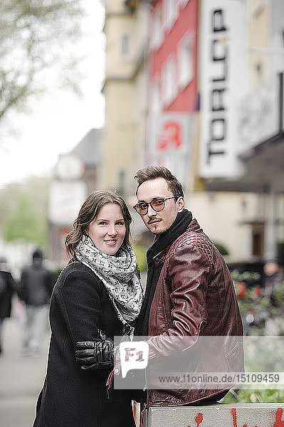 Portrait of stylish young couple in the city