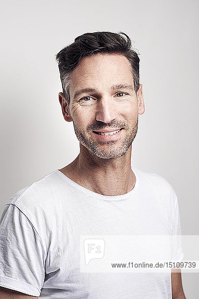 Portrait of man wearing white t-shirt