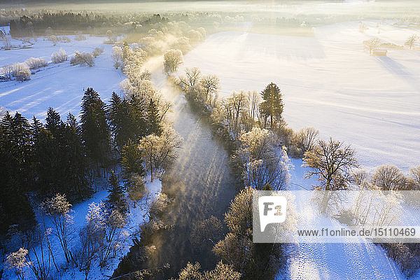 Germany  Bavaria  sunrise at Loisach river near Eurasburg in winter  aerial view