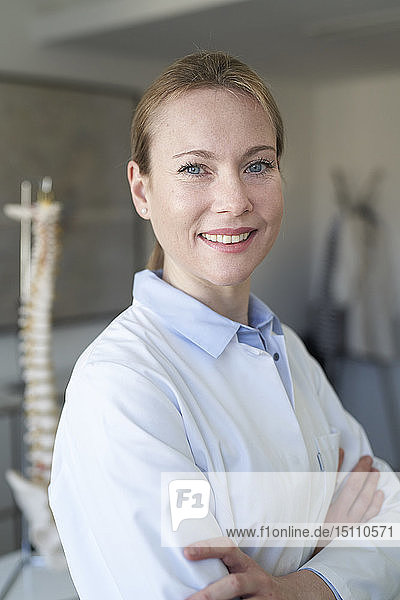 Portrait of confident female doctor in medical practice