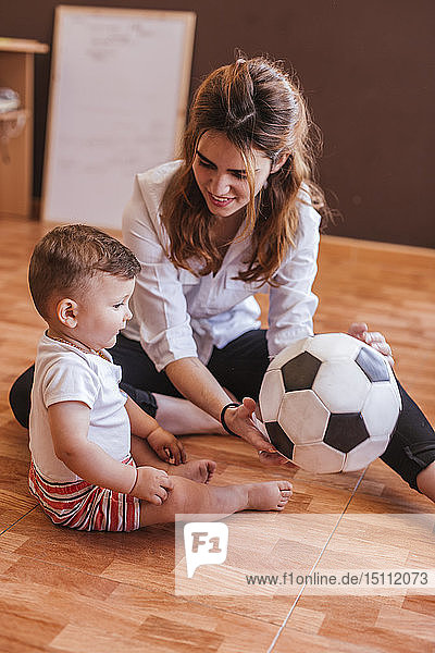 Mother and her son playing with a ball