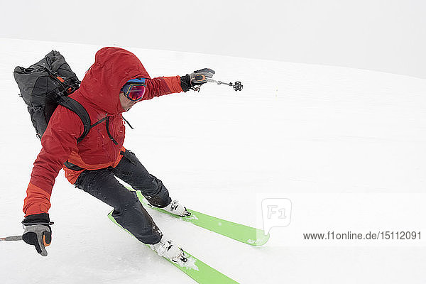 Georgia  Caucasus  Gudauri  man on a ski tour riding downhill