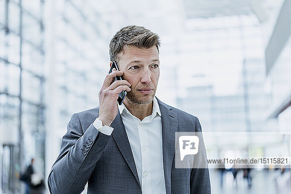 Portrait of businessman on cell phone