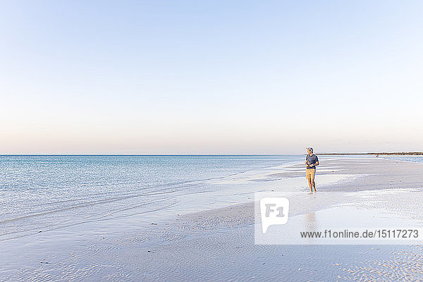 Man on a sandbank in the sea  Holbox  Yucatan  Mexico