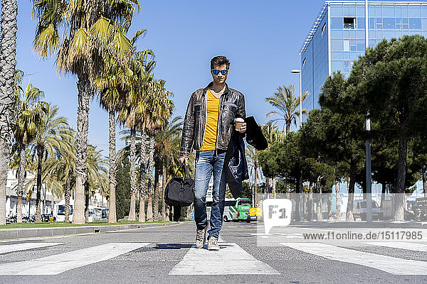 Spain  Barcelona  man in the city walking on the street