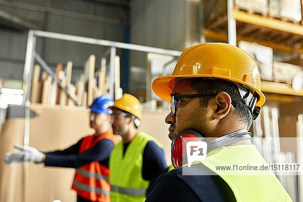 Portrait of worker in factory workshop