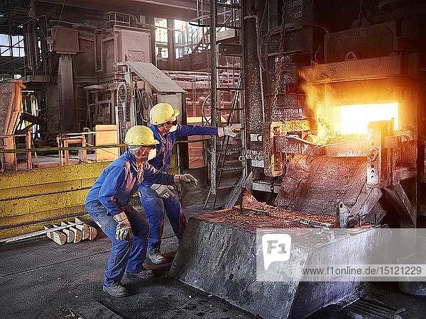 Industry  Smeltery: Workers checking blast furnace for fractures