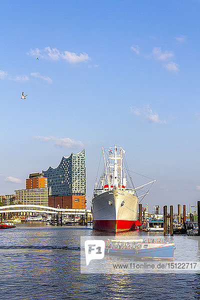 View to Elbe Philharmonic Hall with ship and boats in the foreground Hamburg Germany