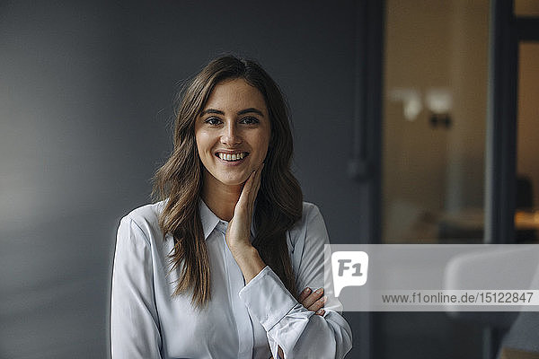 Portrait of happy young businesswoman