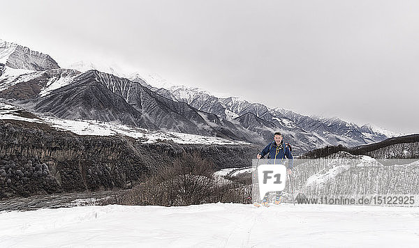 Georgia  Caucasus  Gudauri  man on a ski tour to Lomisi Monastery