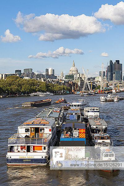 Boats on the River Thames  St. Paul's Cathedral and the City of London from Waterloo bridge  London  England  United Kingdom  Europe