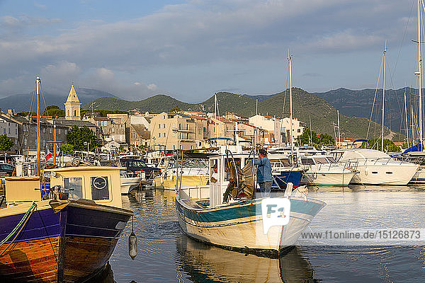 Traditional fishing boat moored in the small harbour of Saint Florent in northern Corsica  France  Mediterranean  Europe