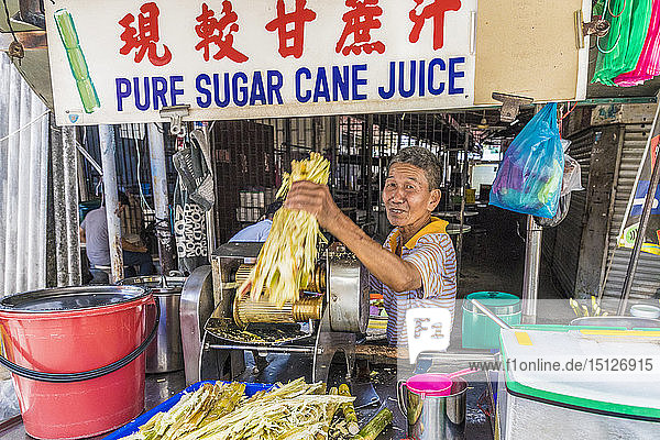 A pure sugar cane juice stall in George Town  Penang Island  Malaysia  Southeast Asia  Asia.
