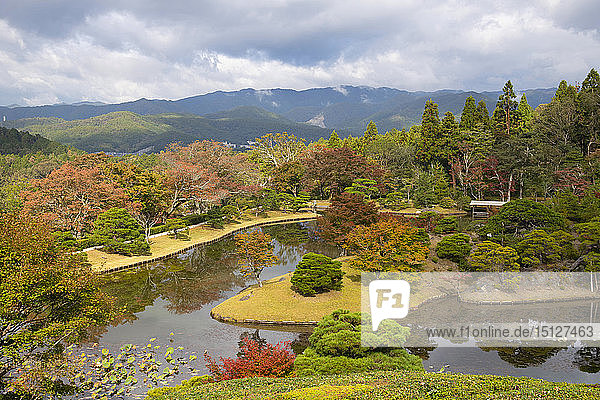 An aerial view of Yokuryuchi Pond surrounded by autumn foliage at the Shugakin Imperial Villa Garden Kyoto Japan Asia