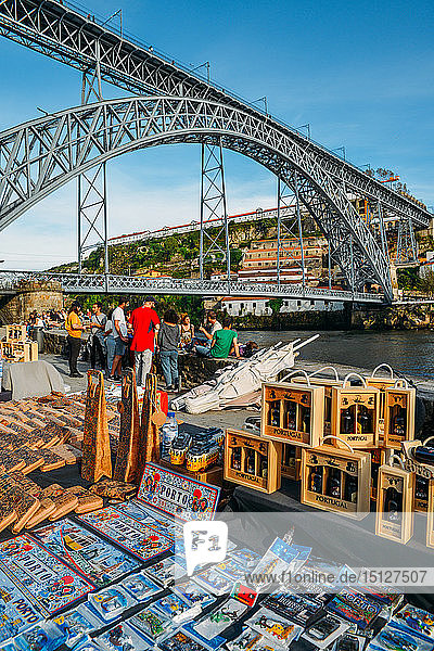 Souvenirs for sale at Cais Ribeira overlooking the Dom Luis I bridge in Porto UNESCO World Heritage Site Portugal Europe
