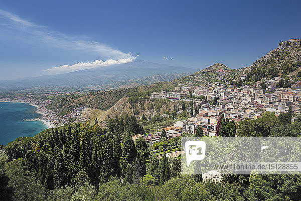 View over the town and coast from the Greek Theatre  Mount Etna in background  Taormina  Messina  Sicily  Italy  Mediterranean  Europe