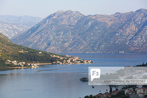 View over the Bay of Kotor from the town walls  early morning  the village of Prcanj prominent  Kotor  UNESCO World Heritage Site  Montenegro  Europe