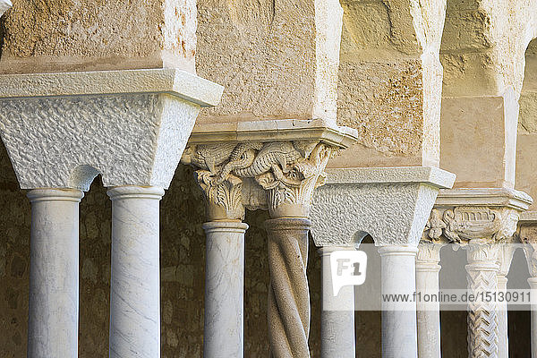 Row of columns and finely carved capitals in cloister of the Arab-Norman cathedral  UNESCO World Heritage Site  Cefalu  Palermo  Sicily  Italy  Mediterranean  Europe