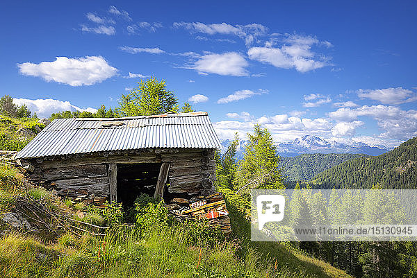 Old hut with Rhaetian Alps in the background Valgerola Orobie Alps Valtellina Lombardy Italy Europe
