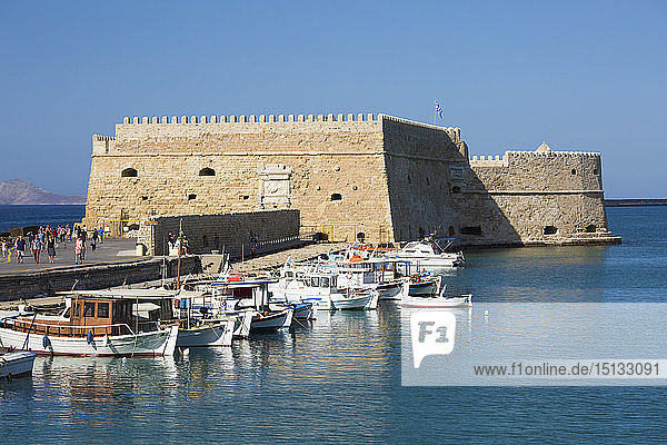 View across the Venetian Harbour  boats moored in front of the Koules Fortress  Iraklio (Heraklion)  Crete  Greek Islands  Greece  Europe